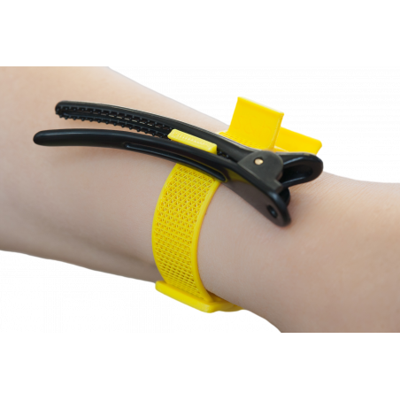 Yellow tool-band on wrist.