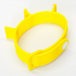 Yellow tool-band coiled into a loop.